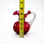 Fenton Art Glass cranberry pitcher featuring molded melon pattern and clear handle