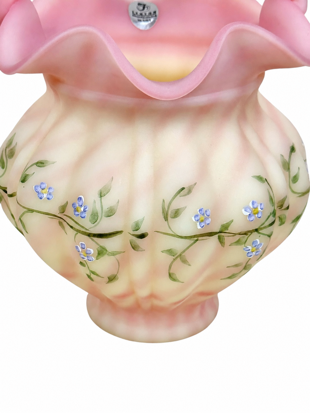 Collectible Fenton Burmese basket featuring delicate floral decoration and ruffled rim