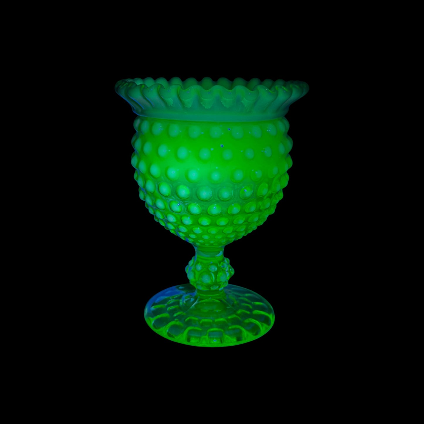 Fenton vaseline uranium glass hobnail compote glowing under UV light