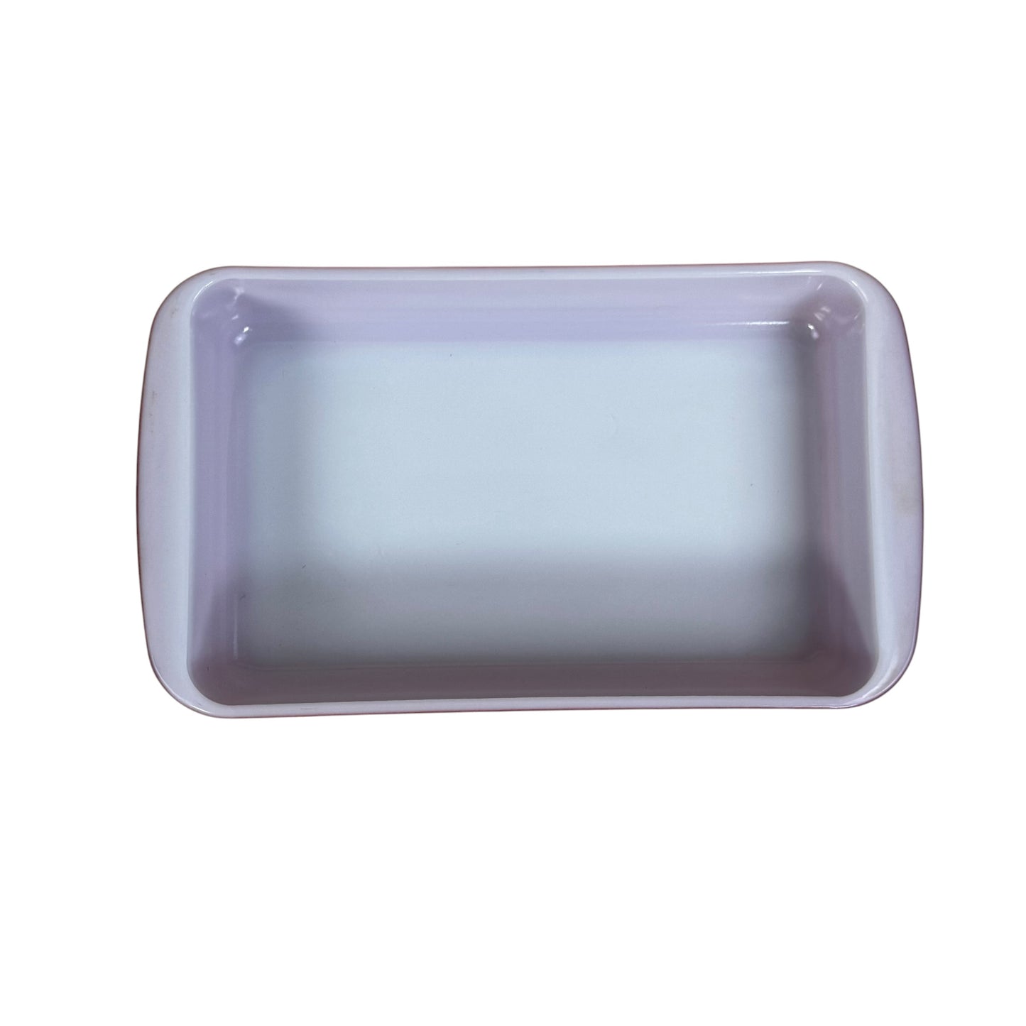 Pink Pyrex rectangular baking dish with white interior