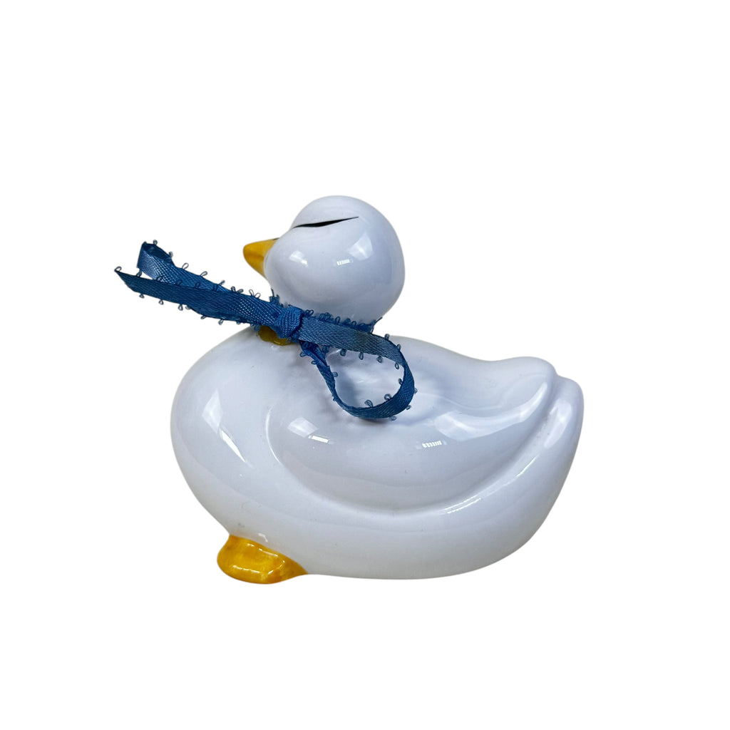white duck statues with blue ribbon bows decorative trio