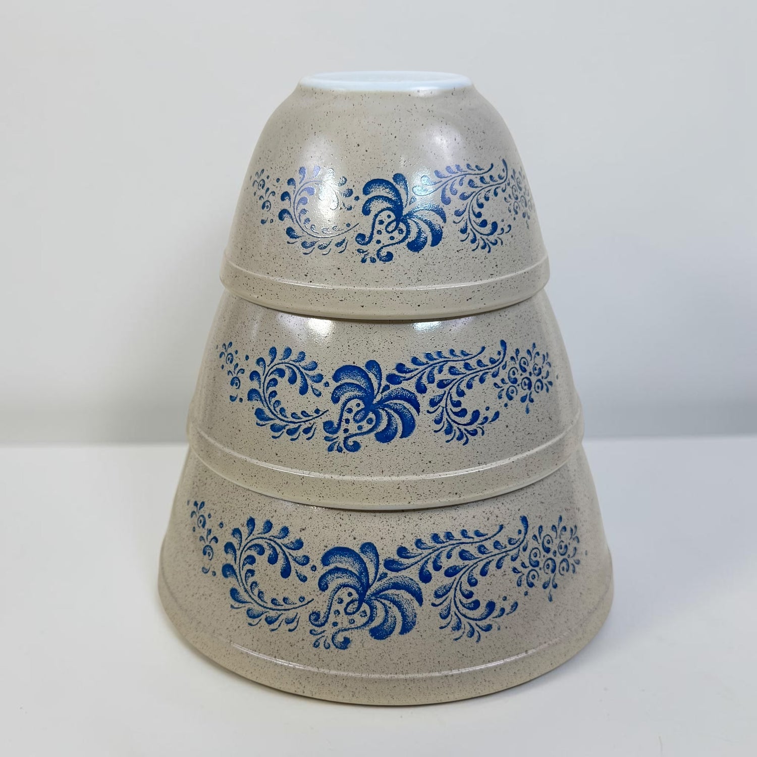 Vintage Pyrex Homestead nesting mixing bowl set with blue folk art design