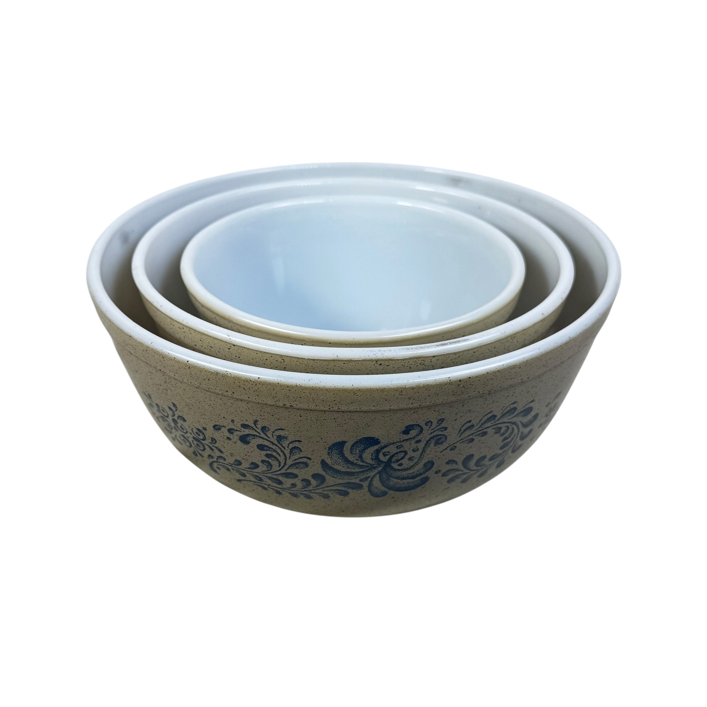 Speckled beige Pyrex Homestead bowls stacked together in farmhouse style