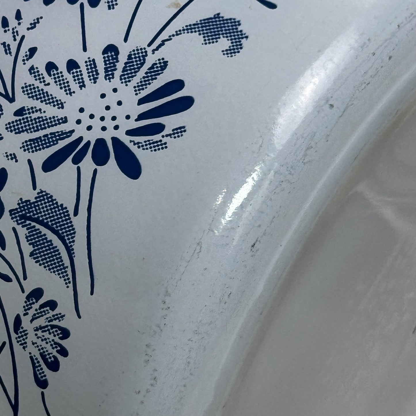 Retro Pyrex covered casserole dish with blue floral detailing