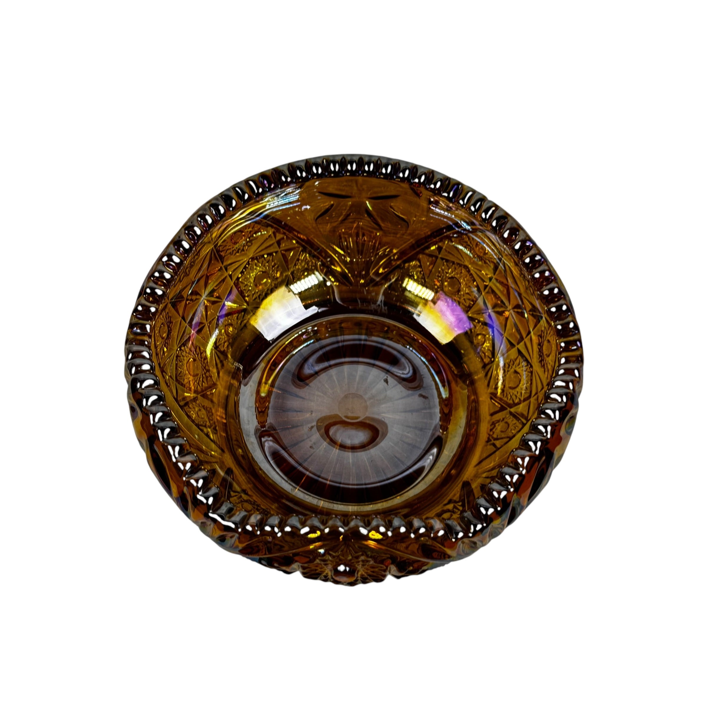 Iridescent amber carnival glass bowl with sawtooth edge