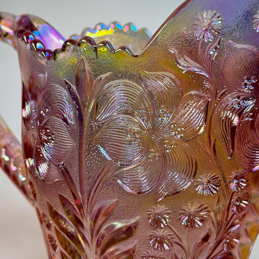 Vintage carnival glass pitcher with embossed Tiger Lily pattern