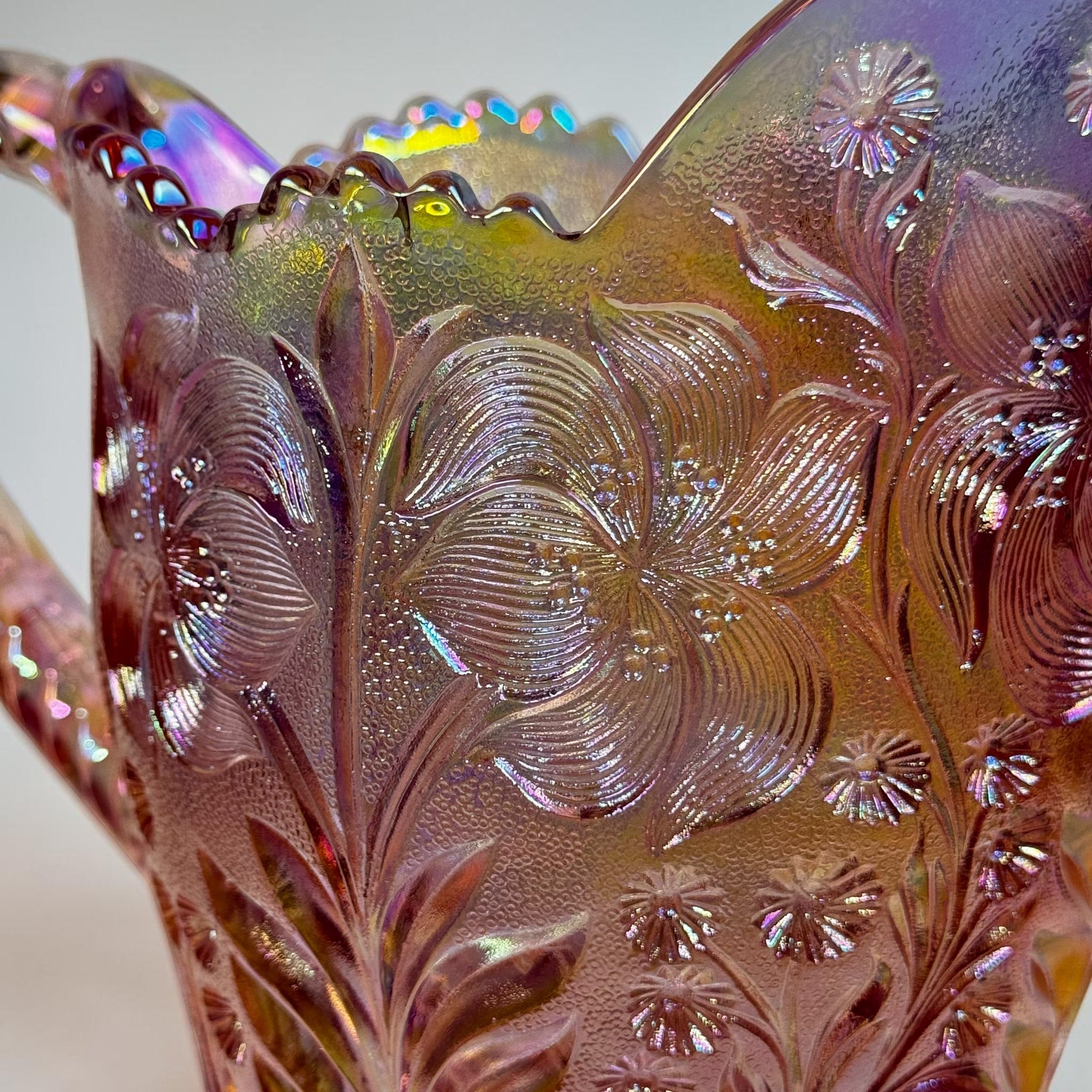Vintage carnival glass pitcher with embossed Tiger Lily pattern