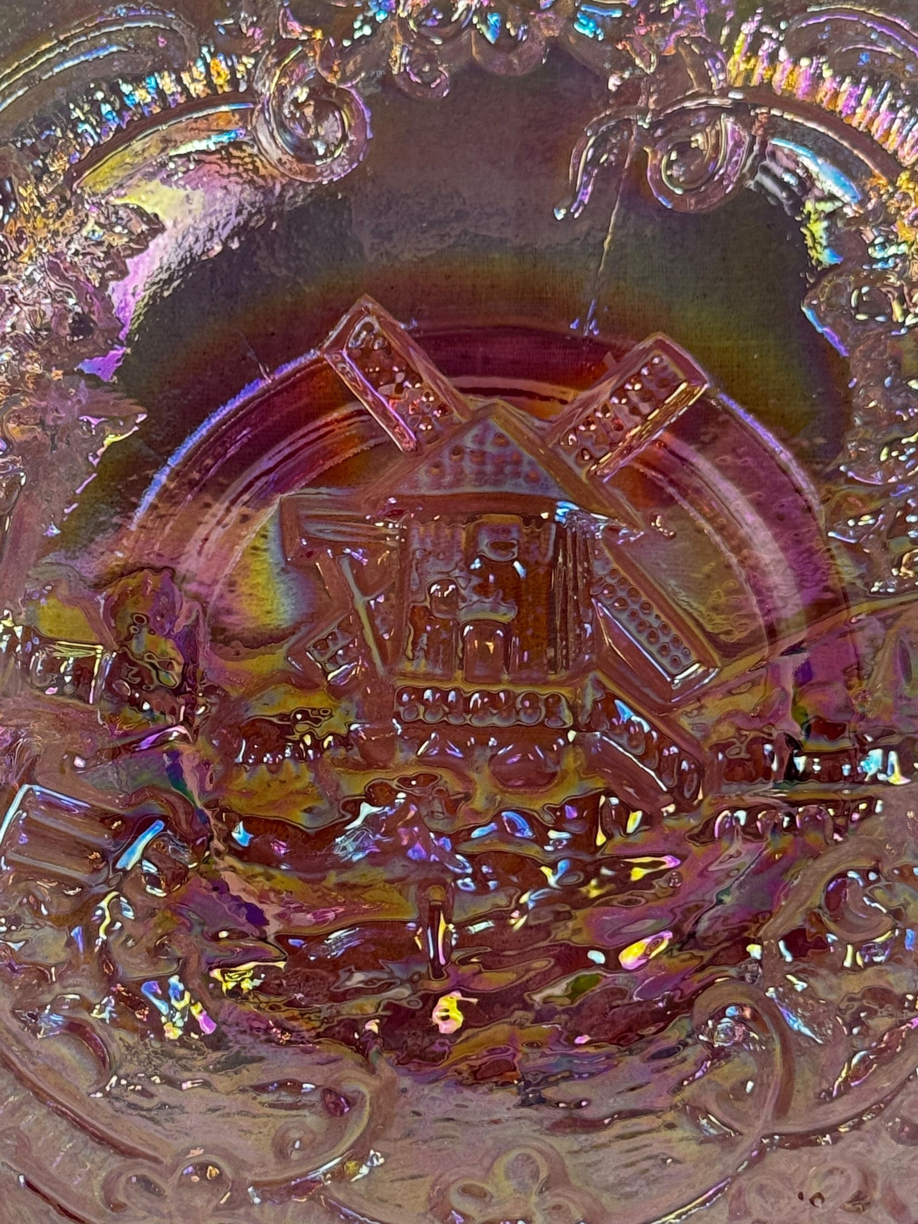 Windmill pattern carnival glass bowl with ruffled edge