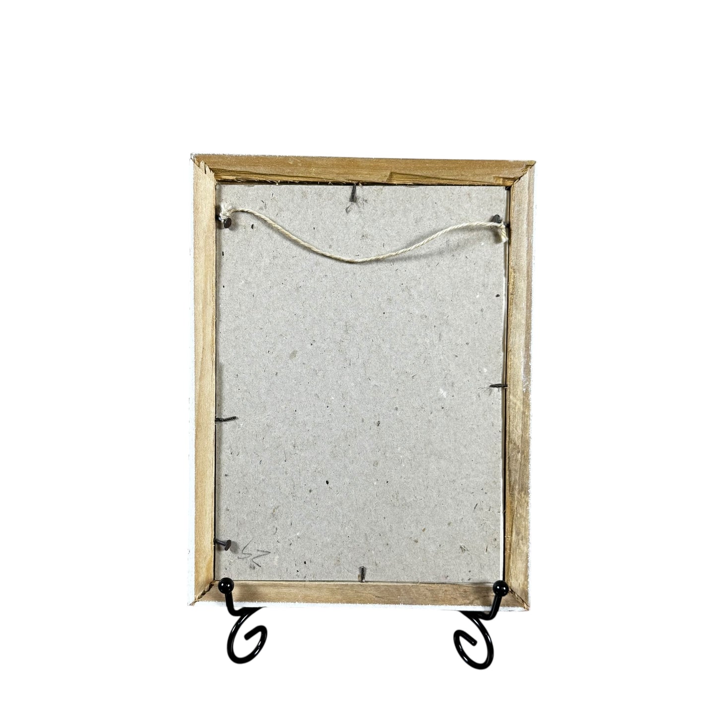Decorative mirror with wooden frame and metal stand on a white background