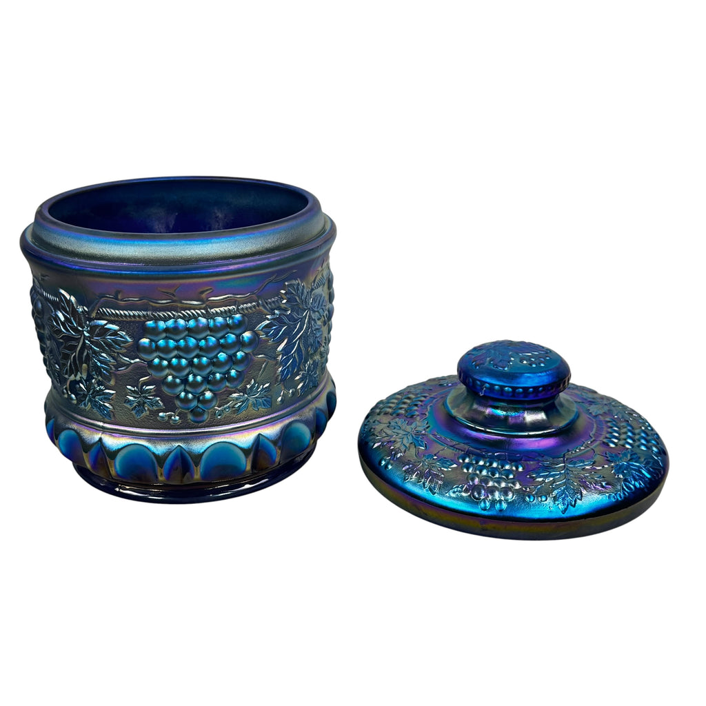 Blue iridescent Fenton covered tobacco jar with grape pattern