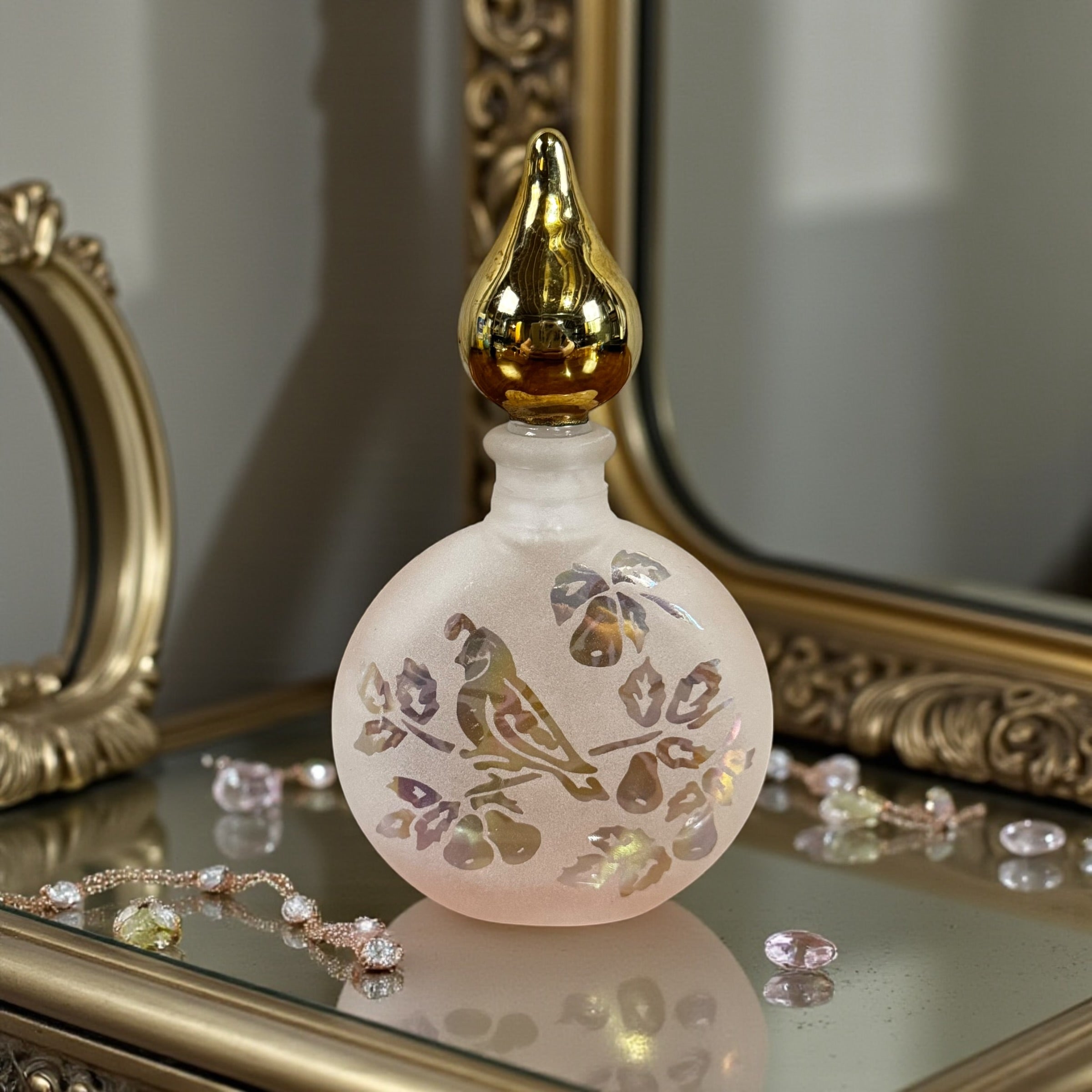 Vintage Art Deco frosted glass perfume bottle with iridescent partridge design