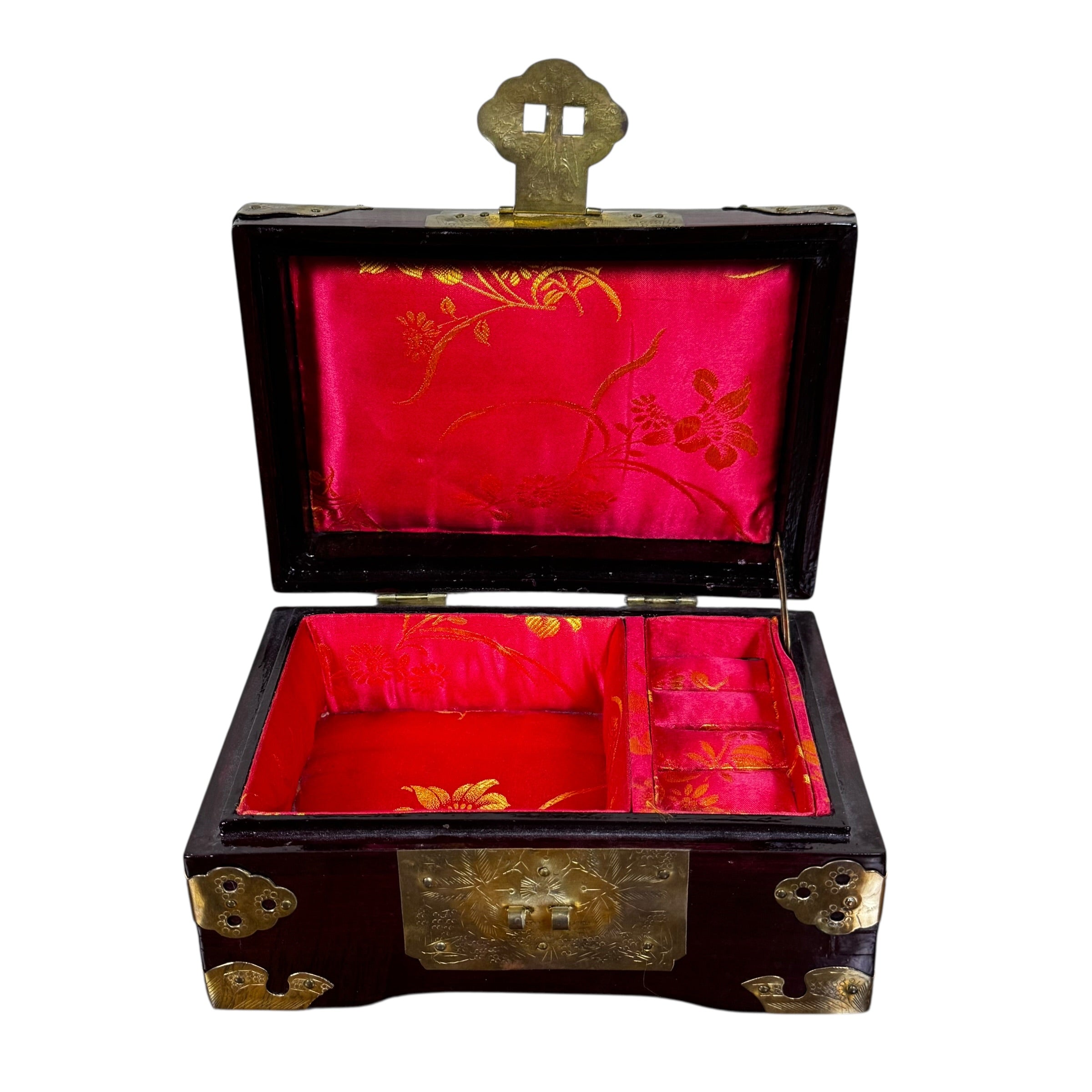 Carved wood jewelry box with ornate brass clasp and jade medallion