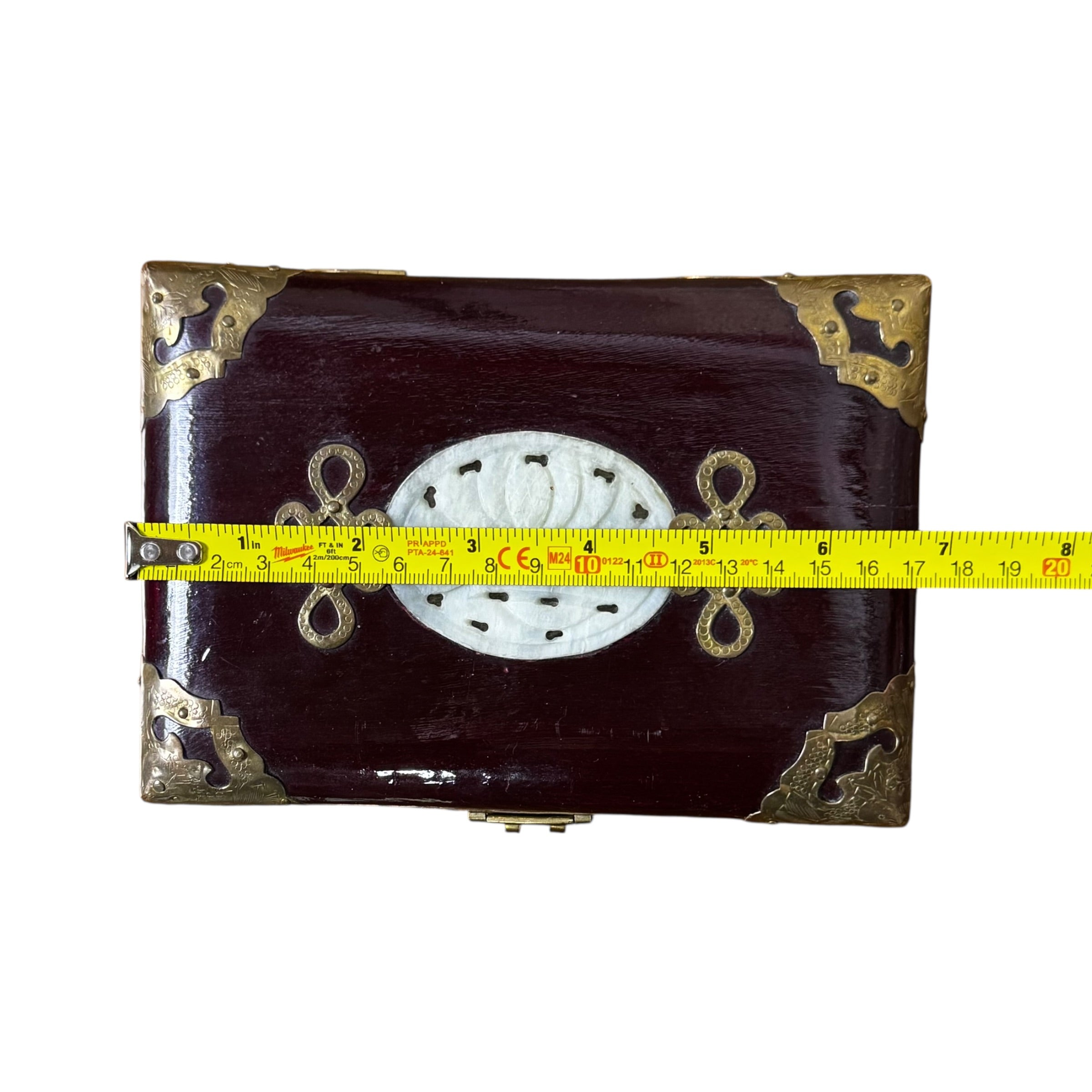 Decorative vintage jewelry storage box with brass corner mounts