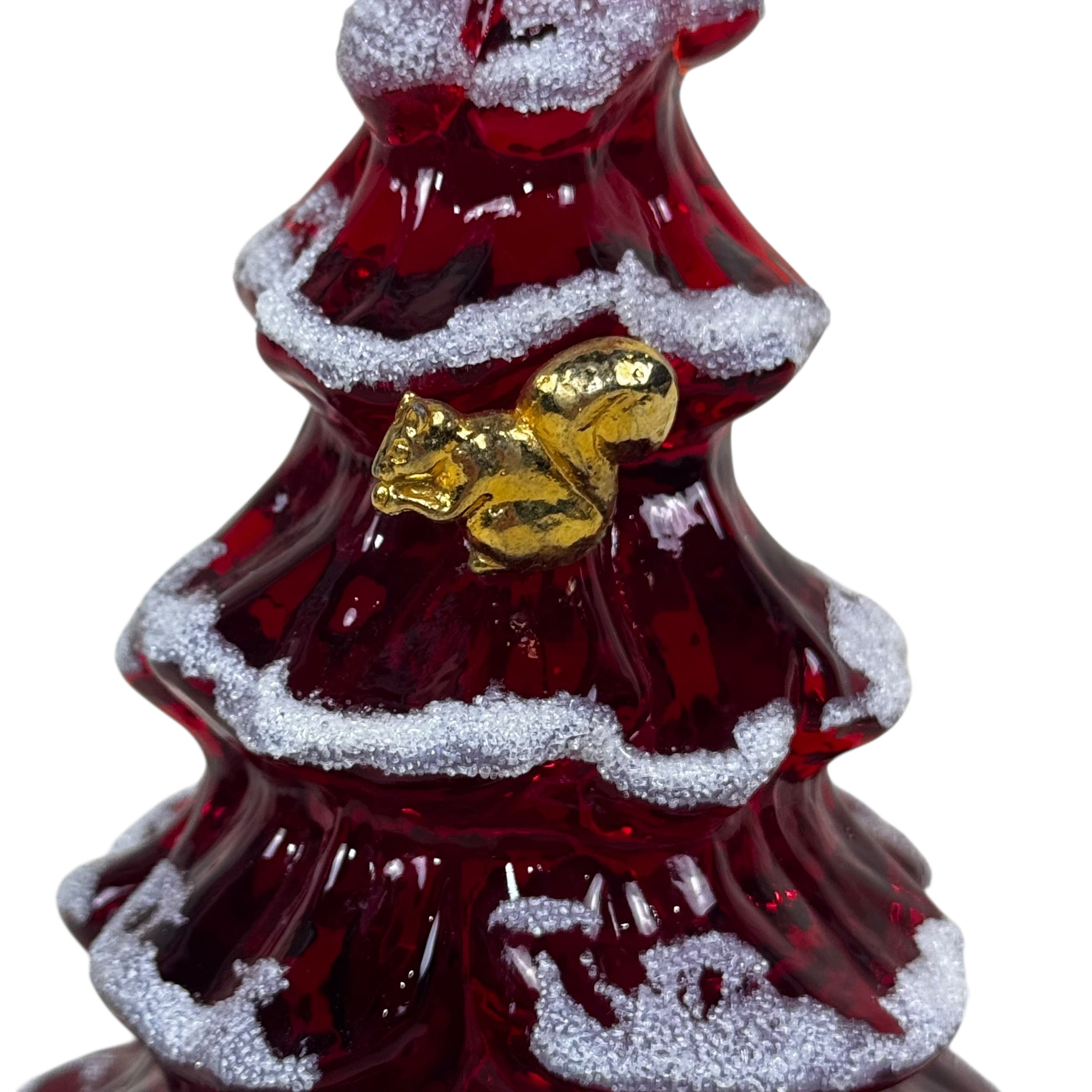 Red glass Christmas tree ornament with gold bow and snowflake details on a white background
