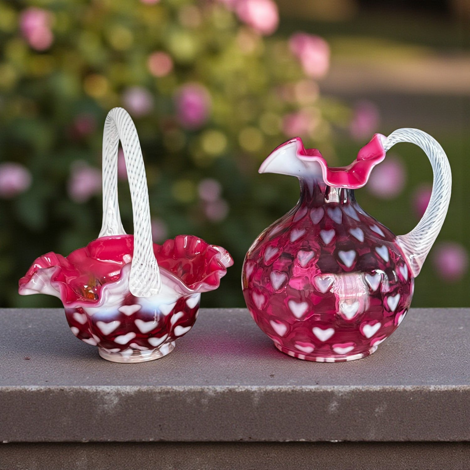 Set of two Fenton cranberry heart optic glass pieces: pitcher and basket